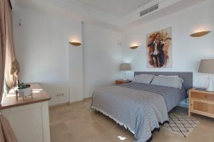 Grey bedroom and SEA views